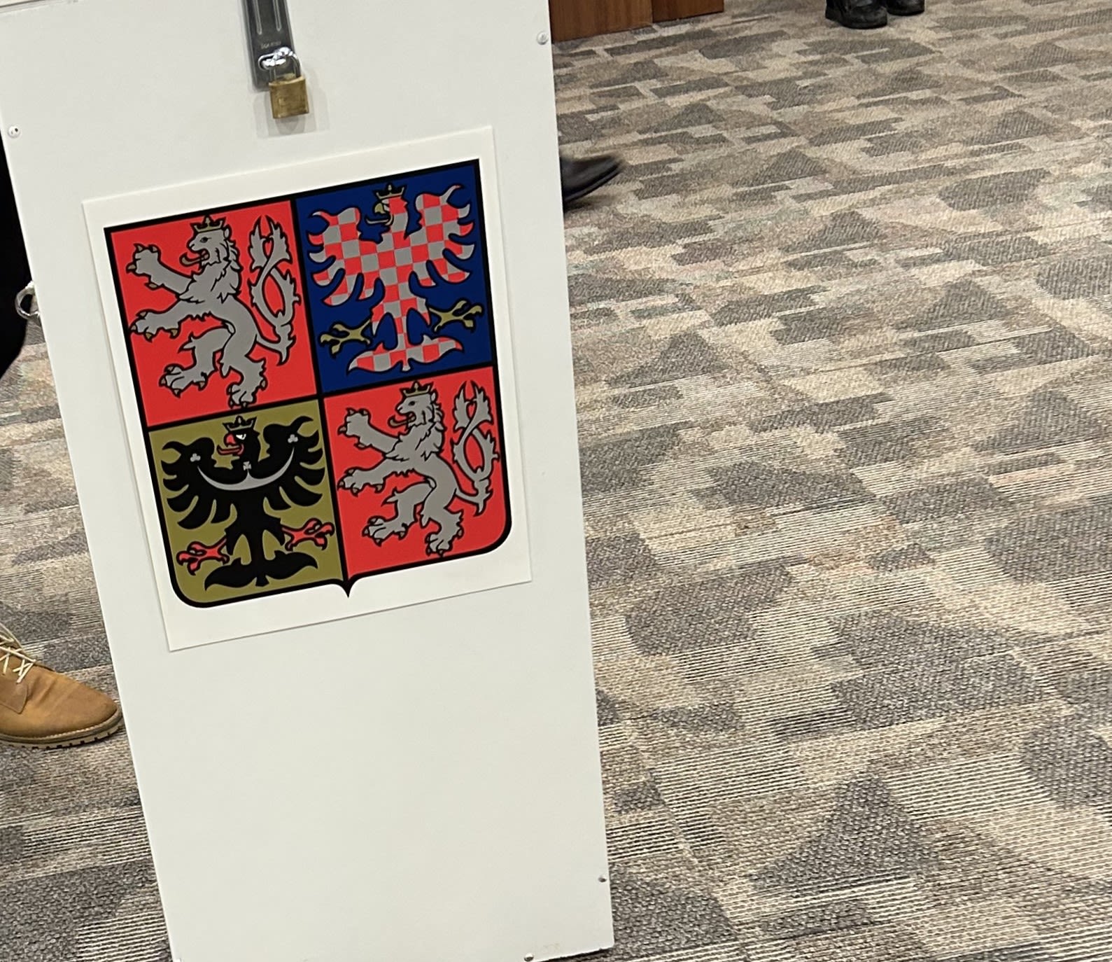 red and white concrete building near body of water during daytime